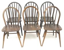 Six mid-century style, dark stained spindleback chairs.