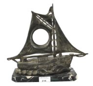 An Art Deco spelter and marble mounted sailing ship pocket watch stand.