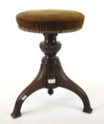 A Victorian revolving mahogany music stool.