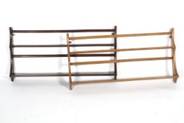 Two mid-century Ercol plate racks.