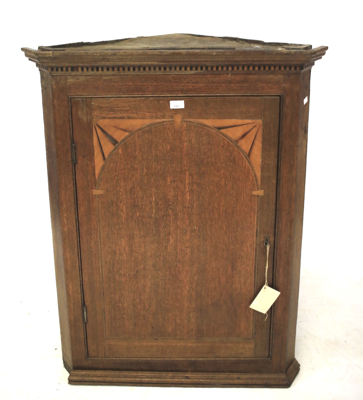 A late 19th century oak corner cupboard.