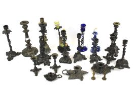 A group of late 19th-early 20th century spelter, white metal and brass candlesticks.
