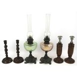 Two Victorian coloured glass oil lamps and two pairs of candlesticks.