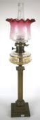 An Edwardian brass column oil lamp.