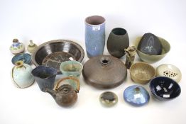 An assortment of British and Continental studio pottery. Glazed in shades of brown, green and blue.