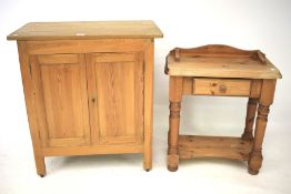 A 20th century pine cupboard and another.
