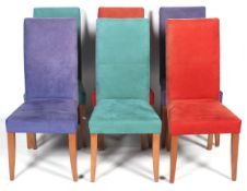 A set of six modern dining chairs.