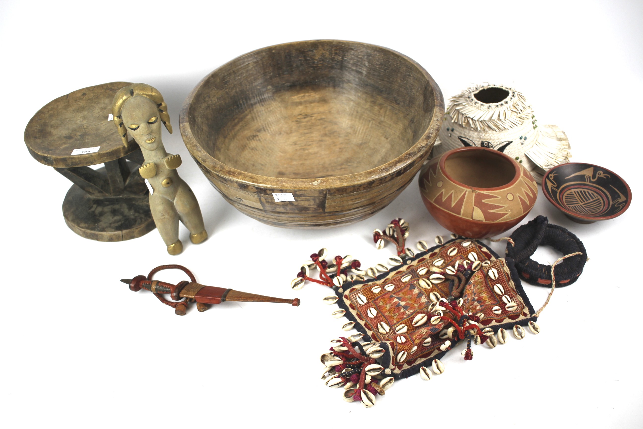 Assorted vintage and modern African and South American tribal items.