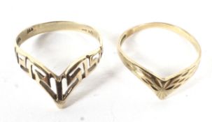 A 14ct gold ring and a 9ct gold ring of similar design. The first weighing 1.5g, the second 0.9g.