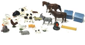 A collection of lead animal figures and accessories.