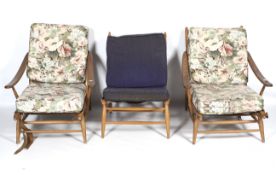 A pair of 1960s Ercol low armchairs and a similar chair.