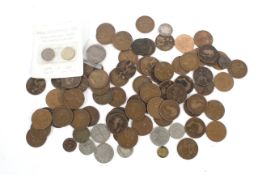 An assortment of British coins. Including pennies, a Georgian coin and a 1937 & 1967 threepenny bit.