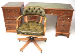 A 20th century burrwood veneer desk with captains arm chair and matching filing cabinet.