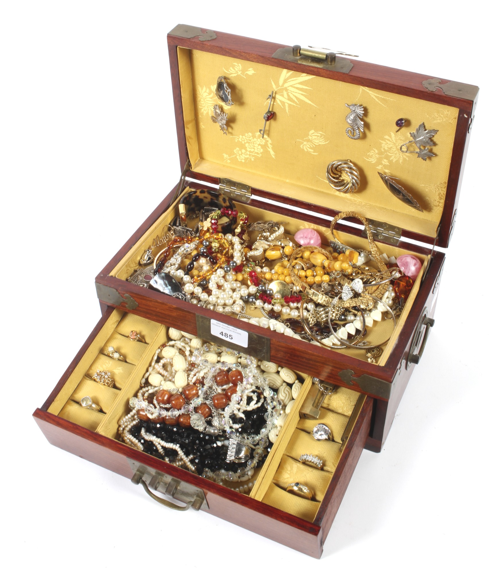 A Chinese hardwood jewellery box containing an assortment of costume jewellery.