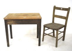 An early 20th century child's pine table and elm seated chair.