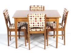 A 1960s Gordon Russell of Broadway teak extending dining table and four G-Plan upholstered dining