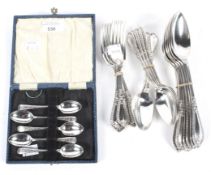 A set of five silver teaspoons and a collection of Walker and Hall silver plated flatware.