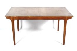 A mid-century McIntosh teak extendable dining table.