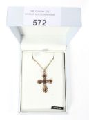 A 9ct gold crucifix pendant necklace.