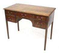 A reproduction mahogany desk.