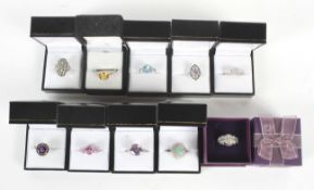 A collection of ten silver gem set dress rings.