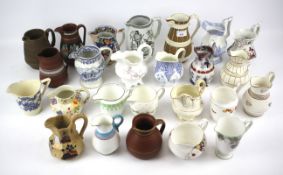 A collection of English pottery and porcelain jugs.