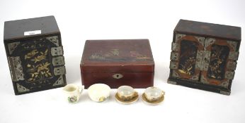 Three Japanese lacquer storage boxes.