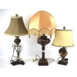 Three assorted table lamps with shades.