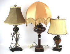 Three assorted table lamps with shades.