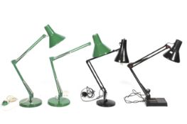 Two green enamel anglepoise style lamps and two black examples