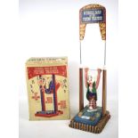 A Mettoy 'Musical Man on the Flying tTrapeze' in original box.