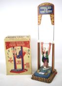 A Mettoy 'Musical Man on the Flying tTrapeze' in original box.