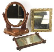 Two 20th century wall mirrors and a mahogany dressing table swing mirror.