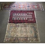 Two rugs and a runner, all with geometric patterns.