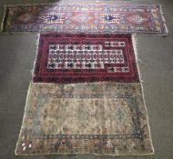 Two rugs and a runner, all with geometric patterns.