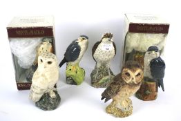 A collection of Royal Doulton and Beswick pottery bird whisky decanters.