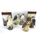 A collection of Royal Doulton and Beswick pottery bird whisky decanters.