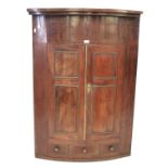 A 19th century mahogany corner cabinet of large proportion.