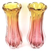 A pair of vintage pink and amber tinted lobed baluster glass vases.