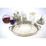 A silver plated oval tray, three condiment sets and further glass items.
