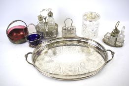 A silver plated oval tray, three condiment sets and further glass items.