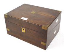 A Victorian mahogany writing box with brass details.