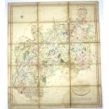 A linen backed folding hand coloured map of Gloucestershire Divided into Hundred, by John Cary,