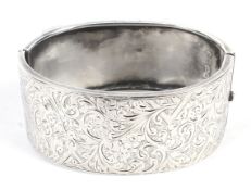 A silver Victorian hallmarked cuff bangle with engraved decoration. Weight 37.5 grams.