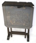 A square tilt-top table carved with a Chinese landscape scene to the top. With glass cover.