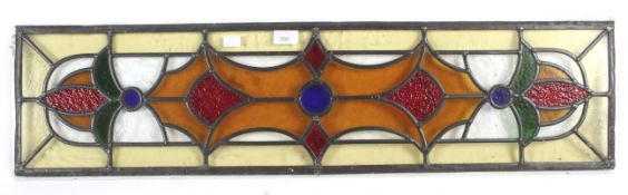 A 1930s stained glass panel of rectangular form.