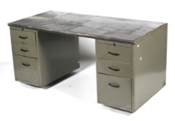 An industrial grey metal desk.