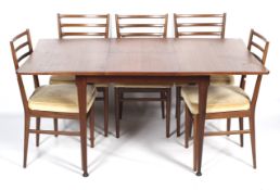 A 1960s teak extending dining table and five Meredew dining chairs.