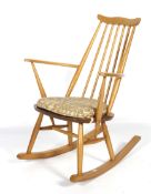 A 1960s Ercol beech and elm elbow rocking chair.