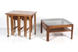 A 1960s/1970s smoky glass topped coffee table and a teak veneer nest of table and stools.